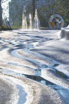 the water is running down the street in the park