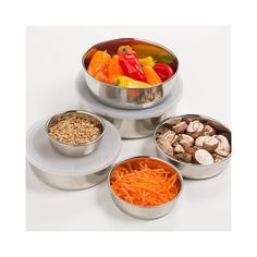 four metal bowls filled with different types of food