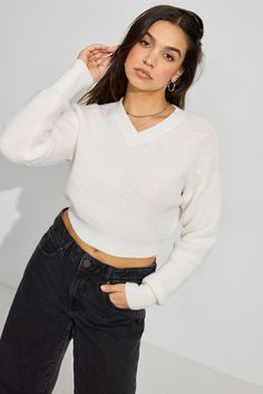 Phone on do-not-disturb, cozy sweater on, vibing. Features - Rib knit - Super soft <3 Size & Fit - Fit: Fitted - Length: Cropped - Model is wearing size S Materials & Care - Content: 50% recycled polyester, 46% polyester, 4% spandex - Care: Machine wash, cold - Imported Back To School Fits, Sweater White, School Fits, Cozy Sweater, Cozy Sweaters, White Sweaters, V Neck Sweater, Long Tops, Vneck Sweater