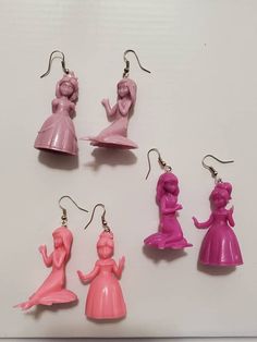 Handcrafted from plastic princess and mermaid figures, available in 3 different colors. Pink Plastic Party Earrings, Pink Plastic Earrings For Party, Mermaid Figures, Mermaid Moon, Fairy Artwork, Mermaid Earrings, Rainbow Necklace, Snake Earrings, Carnelian Beads