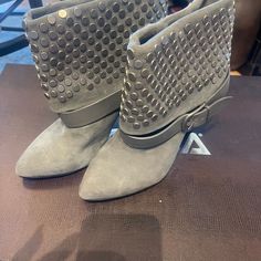 Beautiful Studded, Suede Ankle Boot With A Beautiful Leather Strap Surrounding The Perimeter, Slight Wedge Heel With Leather Bottom Ankle-high Winter Boots With Studded Rubber Outsoles, Chic Ankle-high Studded Heeled Boots, Leather Ankle-high Boots With Rhinestones, Studded Suede Ankle Boots, Luxury Silver-studded Ankle Boots, Studded Ankle Boots, Suede Ankle Boots, Wedge Heels, Bootie Boots