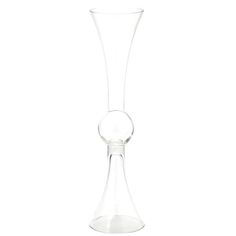 a tall glass vase sitting on top of a table