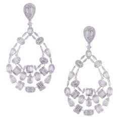 These elegant multi shapes dangling earrings with illusion setting round and baguette white diamonds are crafted in 18-karat white gold, featuring 250 round white diamonds totaling of 2.59 carats and 190 baguette white diamonds totaling of 6.43 carats. These earrings come with push back post backings. VS-G Quality natural white diamonds. Luxury Baguette Diamond Dangle Jewelry, Luxury Dangle Baguette Diamond Jewelry, Baguette Diamonds, Recipes Vegetarian, Dangling Earrings, American Diamond, Gems Jewelry, Diamond Jewellery, Baguette Diamond