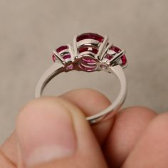 This is a gorgeous handmade creation. Its beauty is its simplicity & Elegance. The 8 mm round cut faceted lab ruby and two 5mm lab ruby is crafted in solid sterling silver and with rhodium plated. All item is sent in a beautiful gift box You can realize more lovely stuff clicking the link https://www.etsy.com/shop/knightjewelry?refshopsection_shophome_leftnav Please leave the correct address and you phone number for delivering successfully. Antique Ruby Ring, Star Ruby Ring, Original Jewelry Design, Sterling Silver Promise Rings, Zircon Ring, Wedding Bridal Jewellery, Ruby Ring, Three Stone Rings, Multi Stone Ring