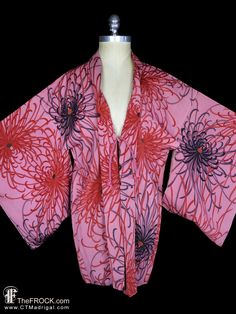 "www.TheFROCK.com www.CTMadrigal.com www.amazon.com/author/ctmadrigal Vintage, near antique, silk kimono with red chrysanthemums on a mauve (or similar) background. Lined in a fan and floral patterned silk. Haori himo ties. Condition is excellent with age-appropriate wear. Measures about 41\" around when tied, and 33\" long. Layaway is available. Age-appropriate wear on vintage and antique kimonos may include slight color variation or bleed on vintage and antique hand-dyed kimono textiles, light Spring Pink One-size Kimono, One Size Pink Kimono For Spring, Pink Long Sleeve Robe With Floral Print, Pink Silk Kimono For Spring, Pink Floral Print Long Sleeve Kimono, Red Long Sleeve Kimono With Floral Print, Red Floral Print Long Sleeve Kimono, Red One-size Kimono For Fall, Red Kimono For Fall