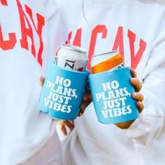 two people are holding cans with no plans, just vibes on them