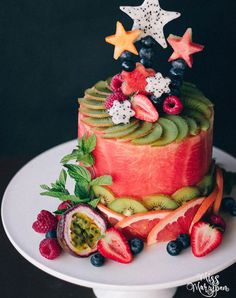 a cake with fruit and stars on top