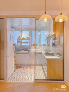 an open kitchen and dining room with sliding glass doors