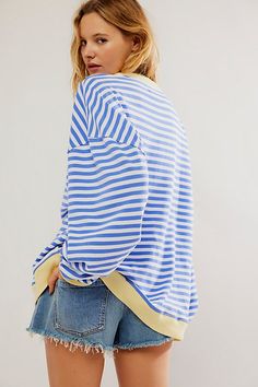 So cool and classic, this timeless crewneck is featured in an oversized, slouchy silhouette and staple striped print with contrasting hems for added dimension. **Fit:** Relaxed, oversized fit **Features:** Crew neckline, dropped shoulders, contrast hems **Why We | Classic Striped Oversized Crewneck by We The Free at Free People in Blue, Size: L