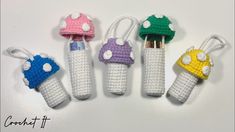 crochet toothbrush holders with mushrooms on them are lined up next to each other