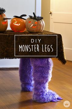 a purple furry monster holding a sign that says diy monsterlegs on it