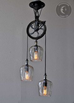 three light fixtures hanging from the ceiling