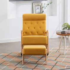 a yellow chair sitting on top of a rug