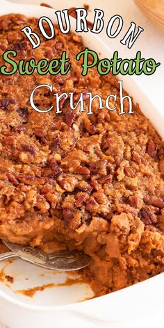 a close up of a casserole dish with pecans on top and the words bourbon sweet potato crunch above it