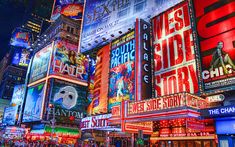 the times square in new york city is lit up at night with neon signs and advertisements