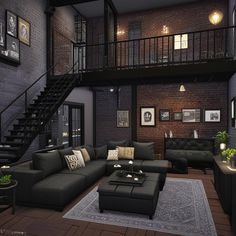 a living room filled with furniture next to a stair case in a loft style home