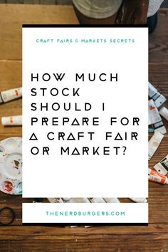 the words how much stock should i prepare for a craft fair or market? on top of a wooden table