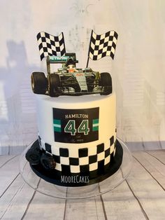 a birthday cake with a racing car on top