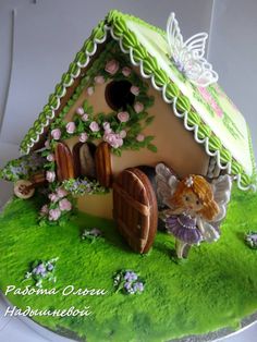 there is a cake that looks like a fairy house