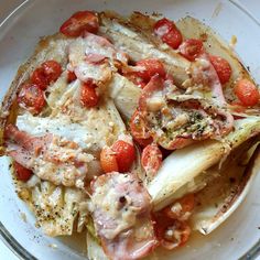 a white bowl filled with food on top of a table