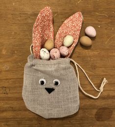 a bag filled with eggs sitting on top of a wooden table