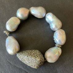 Gorgeous Grey Baroque Pearls With One Piece Covered In Real Diamonds And Other Silver And Diamond Rings As Well. This Bracelet Stretches To Put On. Baroque Pearls, Real Diamonds, Womens Jewelry Bracelets, Put On, Diamond Rings, Diamond Bracelet, Diamonds, Women Jewelry, One Piece