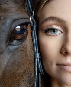 a close up of a person with a horse's face next to her head