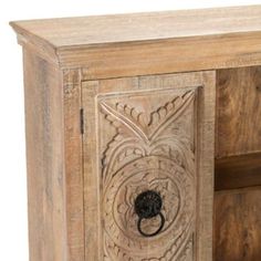 an old wooden cabinet with carvings on the door and drawer handles, isolated against a white background