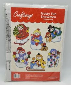 a package of cross stitch snowmen on a white background with red trimmings