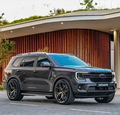 a black truck parked in front of a building