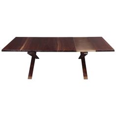 a wooden table with two intersecting legs and a rectangular top, on a white background