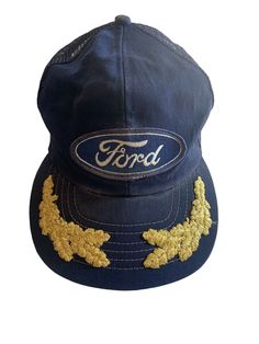 Vintage Ford Patch Snapback Mesh Trucker Hat Union Tag USA Gold Flame Embroidery. Preowned Vintage condition.Snap Back is in good condition no rips or tears.The sweat band is faded and stained.The button on top the hat has some discoloration. Please see photos for further condition smoke free home & environment. Vintage Hat With Embroidered Logo And Flat Brim, Customized Hats, Vintage Flat Brim Hat With Embroidered Logo, Vintage Hats With Embroidered Logo And Curved Brim, Vintage Hat With Embroidered Logo And Curved Brim, Vintage Hats With Embroidered Logo, Vintage Adjustable Hats With Embroidered Logo, Vintage Hat With Embroidered Logo, Vintage Adjustable Brimmed Baseball Cap