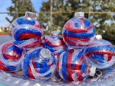 red, white and blue ornaments on a glass plate