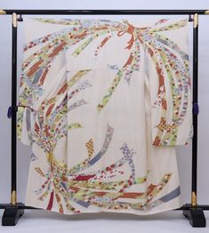 A white silk Furisode wedding kimono dress from Japan. This vintage Furisode Kimono is covered with joyful ribbons of flowers. Enjoy the luxury and quality of Japanese Kimono. Item: Silk Furisode Kimono Robe No. Syfu042 Size: US  S   /  Length 61.5 inch (156cm) ,  Width 22.5 inch (57cm). Design :  Floral ribbons. Condition: Used, Good. Please check the photos. Need a KIMONO RACK to hang this kimono?  Find it here: https://www.etsy.com/listing/1303669853/kimono-rack-japanese-kimono-display-rack Shop the entire collection https://fujiyamarock.etsy.com Ships FREE by Express DHL.  5-10 day delivery from ship by date. Thanks so much for visiting! Kimono Display, Furisode Kimono, Kimono Japanese, White Kimono, Wedding Kimono, Japanese Dress, Floral Ribbon, Display Rack, Kimono Dress