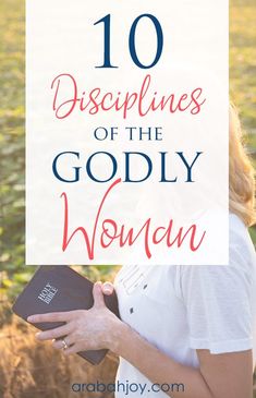 a woman holding an open bible in her hands with the words 10 dispellings of the godly woman