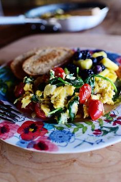 an egg salad on a plate with bread