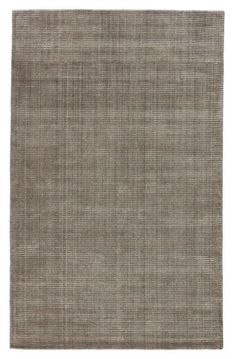 the rug is made from light brown linen and has a large, rectangular design on it