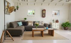 a living room filled with furniture and decor