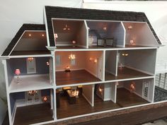 a doll house with all the furniture and accessories in it's display case,