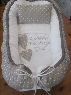 a baby bassinet that has been made to look like it is in the shape of a heart