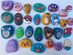 many different colored rocks with faces painted on them