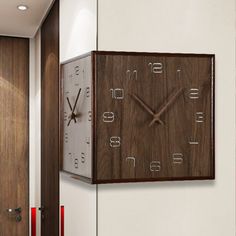 a wooden clock mounted to the side of a wall