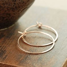 Modern and minimal hoop earrings in lovely warm 14k rose gold fill. These are wonderfully versatile and are a great year-round accessory. I've hammered and tumbled the earrings for strength and shine. Hoops are available in 1 inch and 1 1/2 inch diameters-- please select your size in the drop down menu. See more~ Hoops and metal jewelry- http://www.etsy.com/shop/aubepine?section_id=6718993 Gold earrings- http://www.etsy.com/shop/aubepine?section_id=6307607 The rest of my jewelry shop- http://aub Minimal Hoop Earrings, Brown Diamond Ring, Honey Jewelry, Rose Gold Hoop Earrings, Beautiful Items, Silver Tops, Ethical Jewelry, Gemstone Jewelry Handmade, Gold Filled Earrings