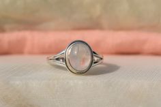 Rainbow Moonstone Ring, 925 Sterling Silver, Oval Gemstone, White Color Stone, Split Band Ring, Natural Gemstone, Gift For Mom Sis, Sale Most of the Products are Made to Order. No two gemstone are similar and images cannot define exact product definitions. Sizes - Available in all Sizes US 1 - US 15 Shipping Policy - I mainly use USPS , DHLE Global Mail Asia, UPS, FedEx for the shipping of goods depending on the amount and days that you have ordered. Usually under normal circumstances the standa White Moonstone Oval Cabochon Ring In Sterling Silver, White Oval Cabochon Moonstone Promise Ring, Adjustable Oval Moonstone Ring In White Gold, White Oval Moonstone Birthstone Ring, Oval White Moonstone Birthstone Ring, Classic Handmade Oval Moonstone Ring, Spiritual Oval Opal Ring In Sterling Silver, Oval Sterling Silver Opal Ring Spiritual Style, Oval Moonstone Crystal Ring Stamped 925