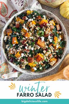 a white bowl filled with faro salad next to some pumpkins