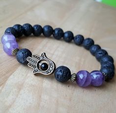 Hand Hamsa lava bracelet, Amethyst Hamsa bracelet, Red jasper bracelet,Black Hamsa bracelet,Protecti Spiritual Lava Stone Stretch Bracelet With Natural Stones, Spiritual Lava Stone Stretch Bracelet Gift, Black Amethyst 8mm Bead Bracelets, Black Amethyst Bracelets With 8mm Beads, Black Amethyst Bracelet With 8mm Beads, Black Amethyst Beaded Bracelets Spiritual, Black Amethyst Crystal Bracelet In Spiritual Style, Spiritual Black Amethyst Beaded Bracelets, Red Jasper Bracelet