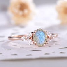 a close up of a ring with a blue and white stone on it's side