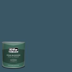 a can of behr ultra stain - blocking paint on a dark blue background,