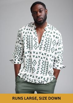 Style#M2102WOT*This item runs large, please size down when ordering.* Ajisomo, meaning "wisdom" in Yoruba, gives a modern twist on traditional African attire. The tunic in White Olive Tribal print blends cultural richness with contemporary flair, featuring a distinctive print that commands attention. Ideal for versatile styling, it pairs seamlessly with white pants for a polished look or jeans for casual sophistication. Shop the matching items. Features: V-Neck Long Sleeve Tunic Vents at sides S White Printed Long Sleeve Shirt, White Long Sleeve Bohemian Shirt, White Bohemian Relaxed Fit Shirt, Bohemian White Shirt With Graphic Print, White Bohemian Shirt With Graphic Print, Traditional African Attire, Mandarin Collar Shirt, African Inspired Fashion, African Inspired