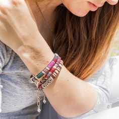 These fun, casual, and gorgeous bracelets are one of our best sellers and are perfect for adding some 'boho flair' to any outfit! Each piece features beautiful and colorful Guatemalan fabric wrapped around a bracelet that is detailed with silver beaded accents. Wear one or stack them - collect them all! As always... Handmade and Fair Trade! 7 1/2" L 100% Cotton Fabric Silver Beads and Clasp Colors/Patterns Will Vary Price is for one random Bohemian Fabric and Bead Bracelet WARNING: CHOKING HAZAR Bohemian Woven Wrap Bracelet For Festivals, Multicolor Hand Wrapped Braided Bracelet, Bohemian Pink Wrap Bracelet For Festival, Bohemian Braided Bracelets With Colorful Beads, Multicolor Woven Beaded Bracelets, Bohemian Silver Wrap Bracelet With Colorful Beads, Bohemian Bangle Friendship Bracelets, Pink Bohemian Wrap Bracelet, Silver Bohemian Braided Bracelets